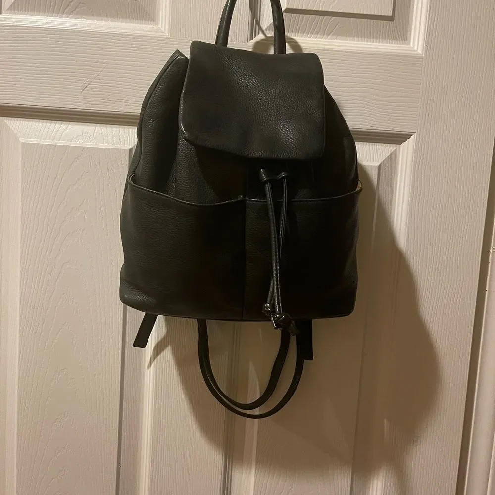 Tignanello Leather Black small Backpack string straps closure.